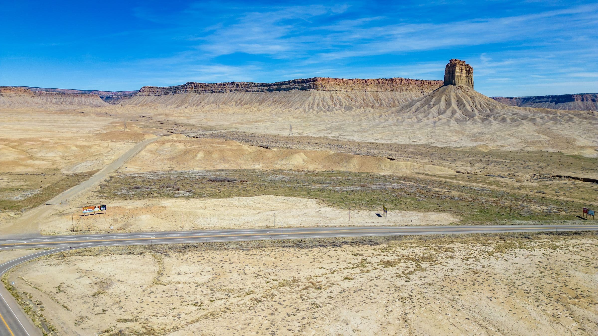 Desert mesas and a road west of Loma, CO
