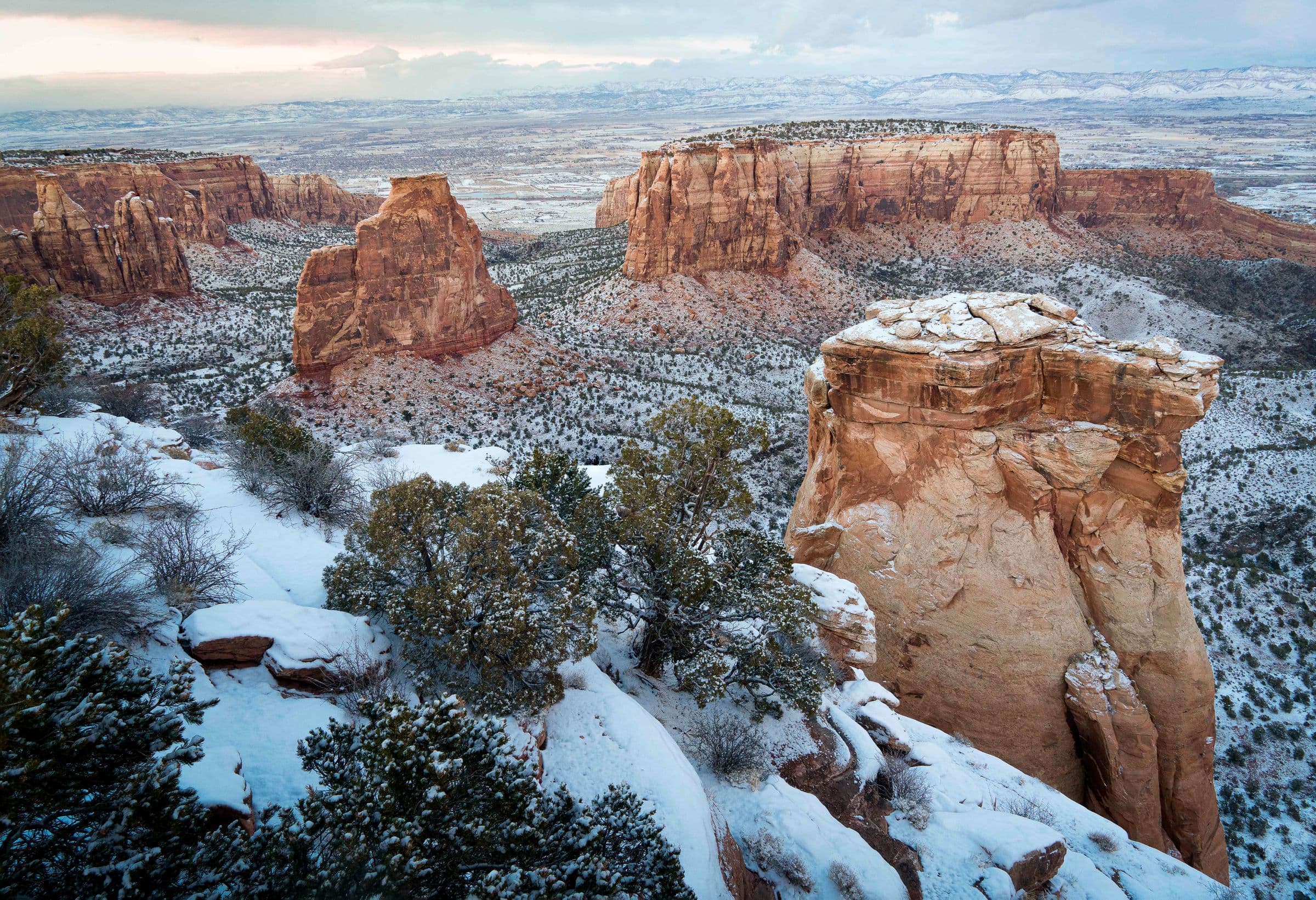 Snow on red rock formations above the Redlands, CO