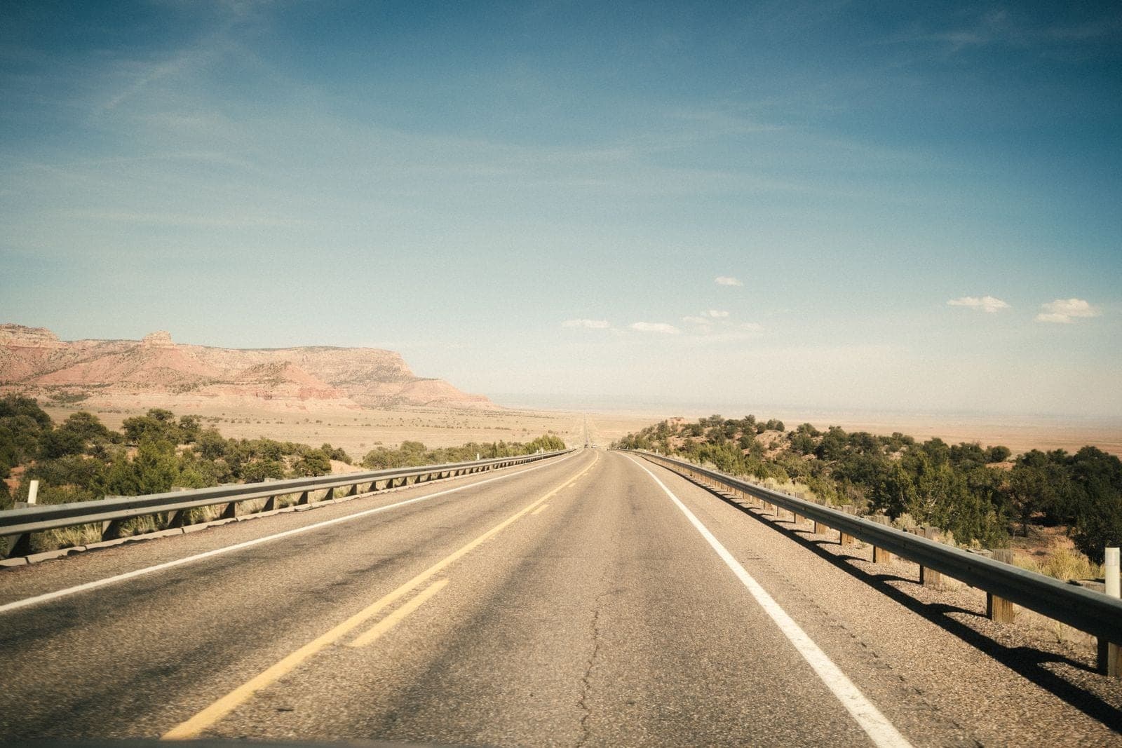 Open highway through dry desert country