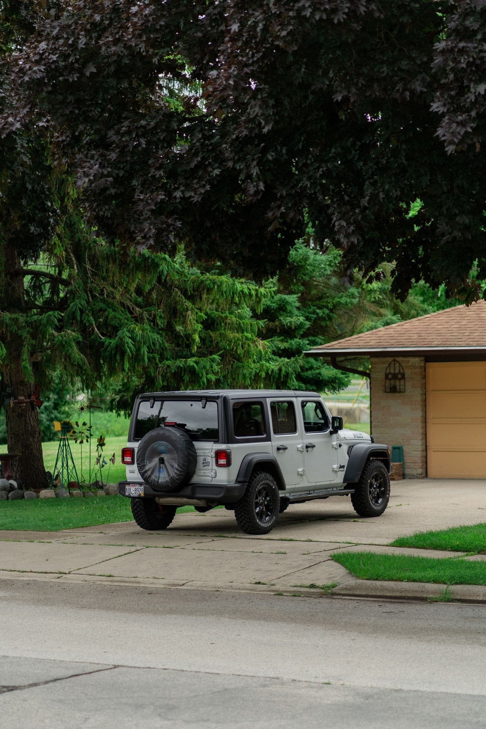 Jeep parked in a home driveway, the usual spot for a mobile windshield replacement