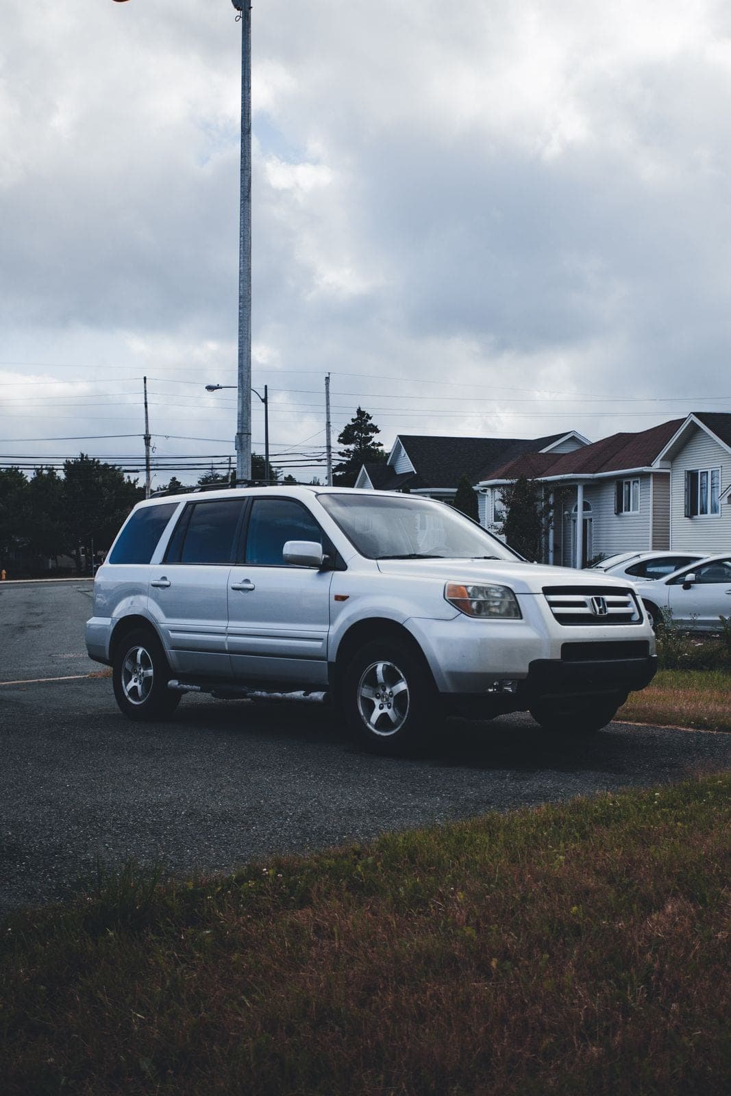 White SUV parked on a residential street