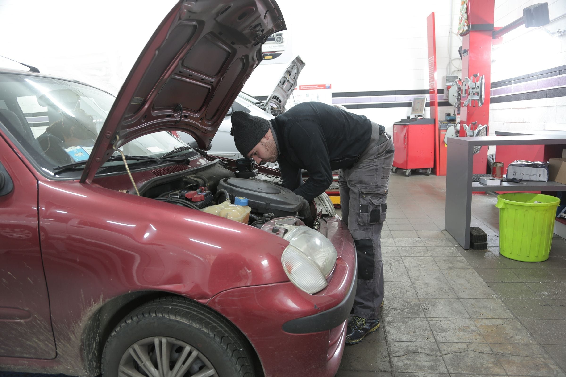 Auto glass technician at work in a shop serving Grand Junction